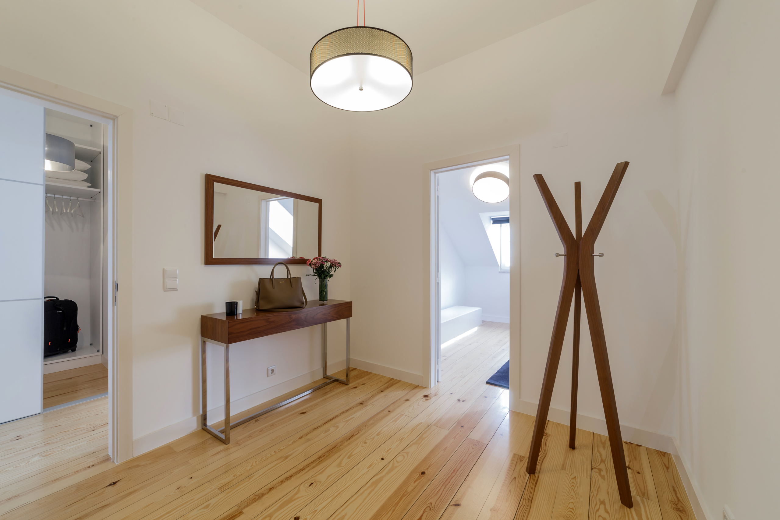 Modern apartment with white walls and light wooden floor Renovated apartment with balcony