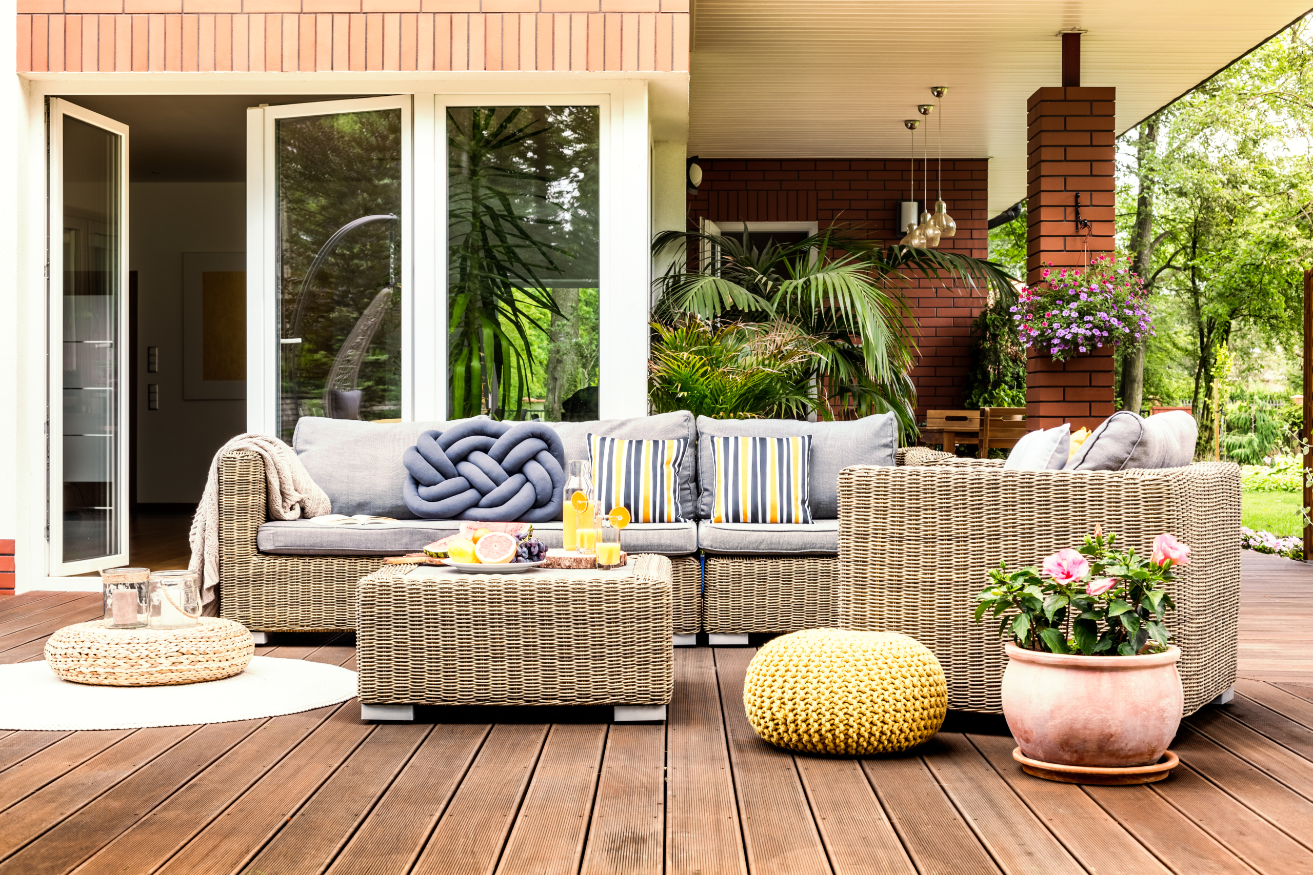 Beige garden furniture on terrace Waterfront property